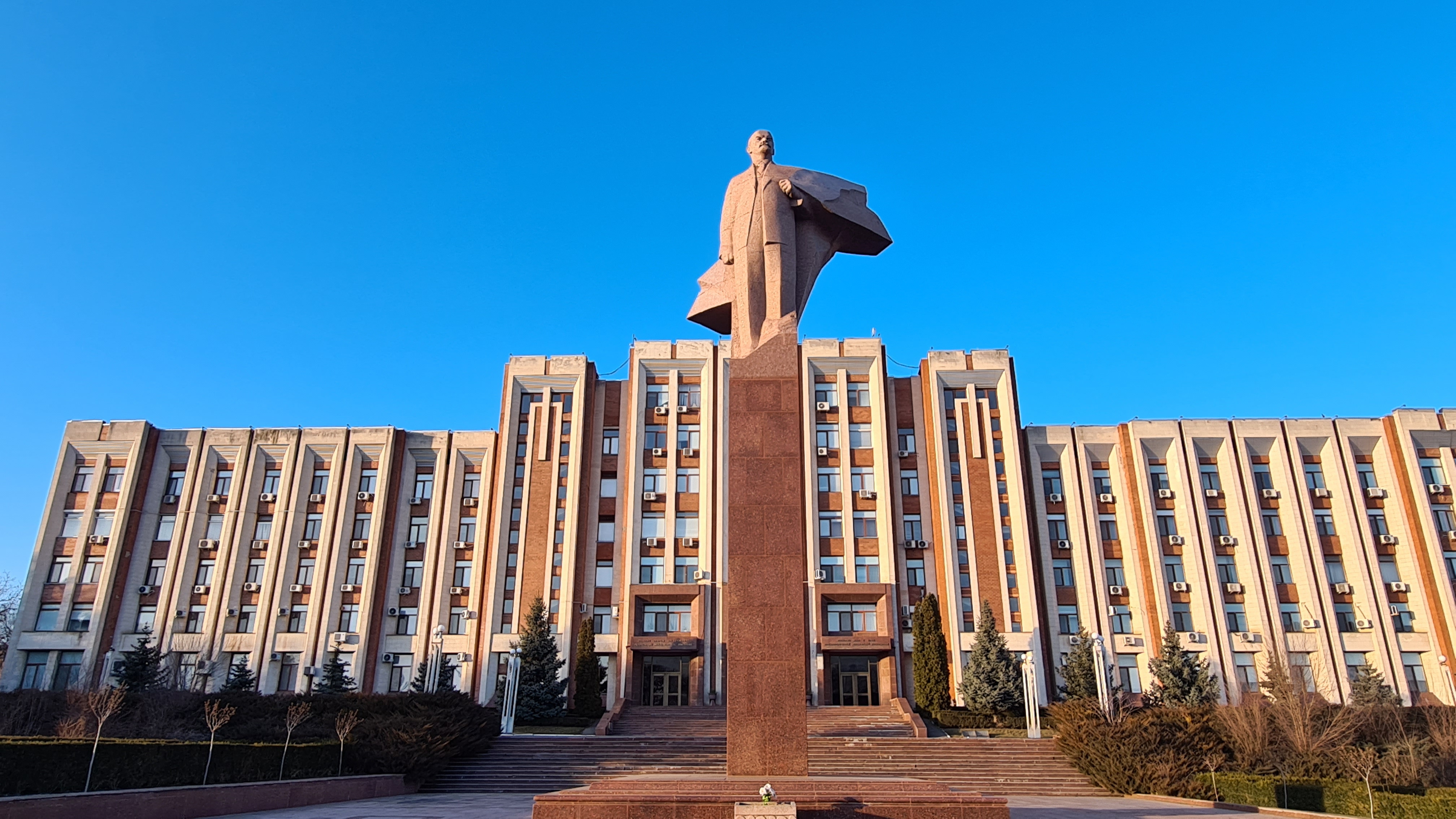 Tiraspol, Moldova – February 13, 2022: Lenin statue in front of the Transnistria Parliament, made out of granite and modeled in 1970 by Nikolai Tomsky.
