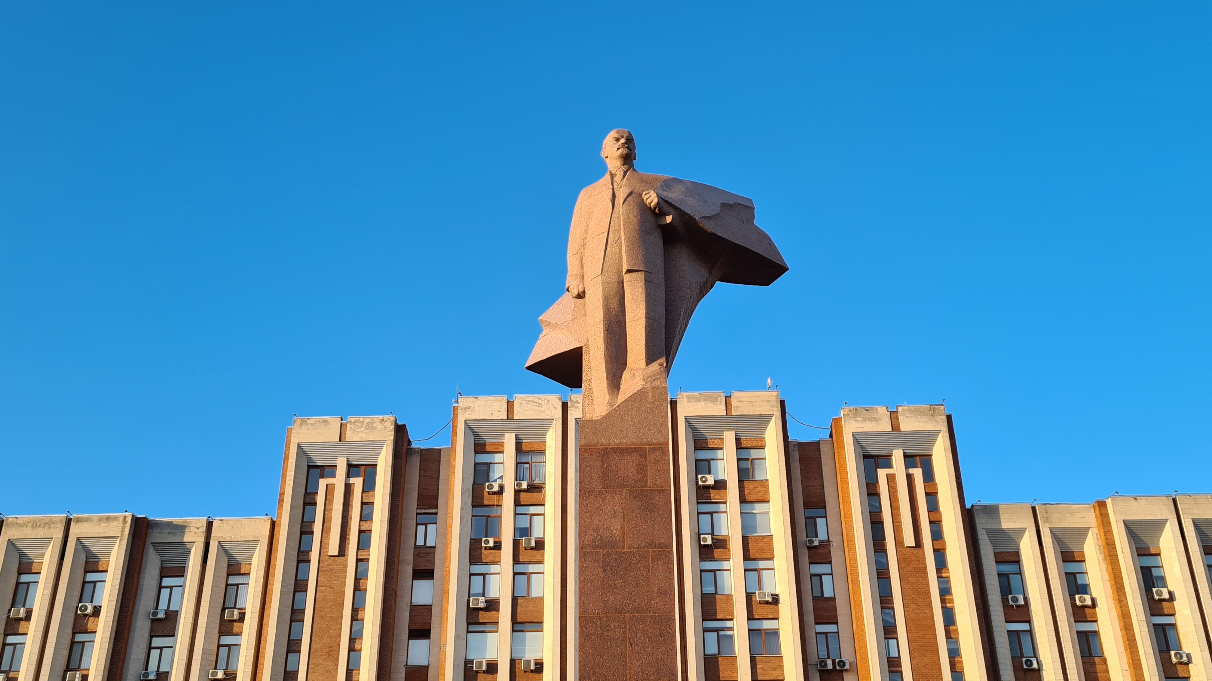 Tiraspol, Moldova – February 13, 2022: Lenin statue, made out of granite and modeled in 1970 by Nikolai Tomsky. Currently it is in front of the Transnistria Parliament but it has been on Leninplatz (currently United Nations Square) in East Berlin until 1992.